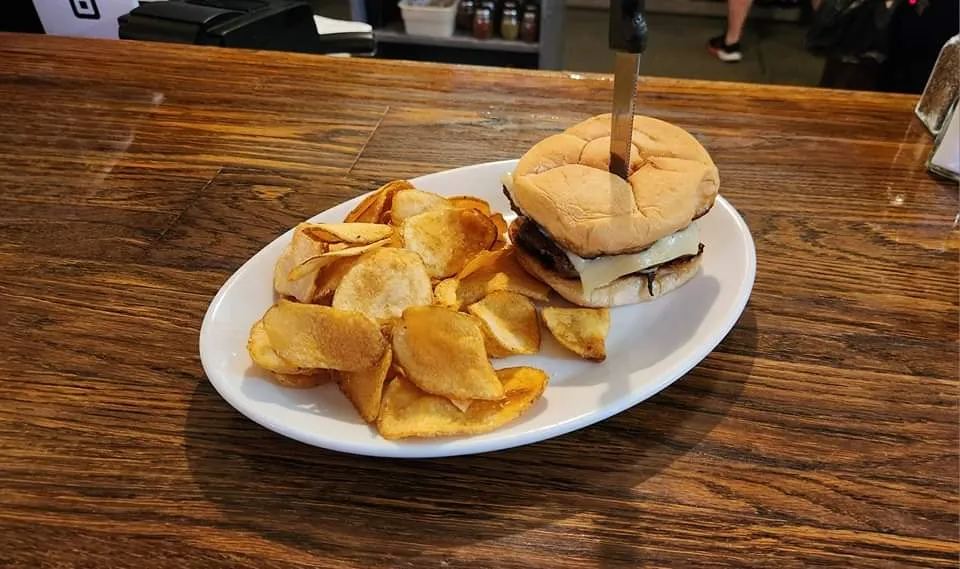 A Wagyu Smash Burger Infused with Onion Topped with a Swiss and Provolone